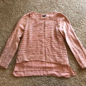 Pink sweater with polyester lining.